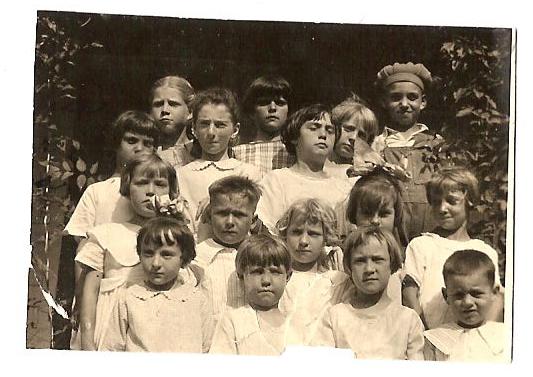 Marguerite's birthday party Front row (left to right): Unknown, Henrietta Evans, Unknown, Johnny Giachino. Second row: Katter Cunningham, Gene Cunningham Marguerite Girotti (blond hair), Lenora Giachino, Cora, Weenie Evans. Third  and fourth rows: Evelyn Mattivi, Frances Nelson, Corva, Mildred Skelton, Anna Sha, unknown, and Jim Mattivi (Evelyn's older brother).